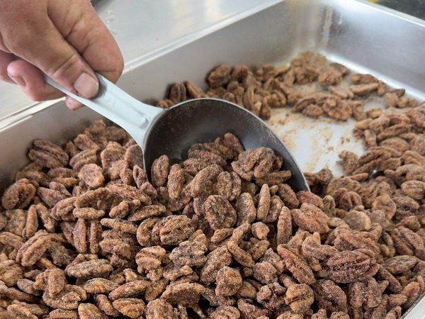 Candied pecans with a scoop